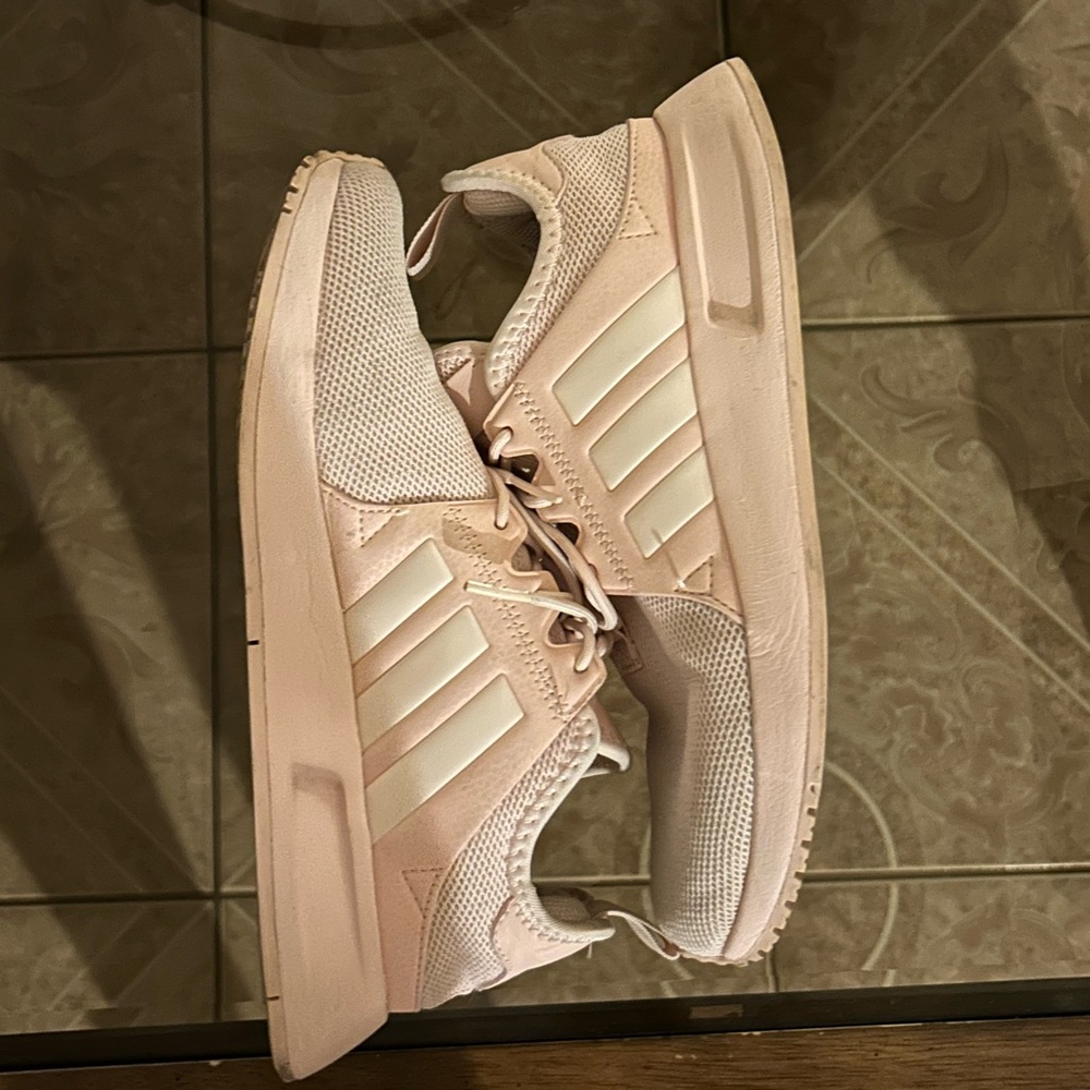 Baby pink adidas running shoes